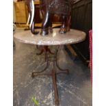 A FRENCH MOTTLED LIVER RED MARBLE CIRCULAR TABLE TOPPED WROUGHT IRON TRIPOD TABLE Dia.77 x H.73cms