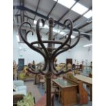 A THONET STYLE BENTWOOD COAT AND STICK STAND, THE REMOVABLE TOP OF SIX HOOKS ON QUATREFOIL SECTIONED