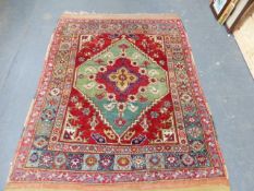 AN ANTIQUE TURKISH BERGAMA RUG. 200 x 134cms.