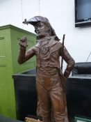 A BRONZE FIGURE OF AN EARLY 19th.C.DANDY RAISING HIS RIGHT HAND TO HIS BICORNE HAT. H.75cms.