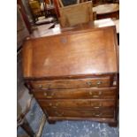 A MAHOGANY BUREAU WITH FIVE GRADUATED LONG DRAWERS OVER BRACKET FEET. 89 x 68 x 41cms.