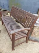 A TEAK GARDEN BENCH. W.154cms.