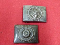 A THIRD REICH SS BELT BUCKLE (REPAIRED) TOGETHER WITH A HITLER YOUTH BUCKLE. (2)