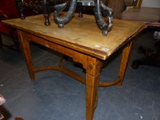 AN OCHRE YELLOW PAINTED PINE DRAW LEAF TABLE ON TAPERING SQUARE SECTIONED LEGS JOINED BY TWO ROUND