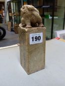 A CHINESE SOAPSTONE SEAL SURMOUNTED BY THE FIGURE OF A BUDDHIST LION. H.15cms.