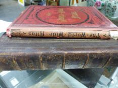 TWO WORLD ATLASES, THE LEATHER BOUND FOLIO EDITION BY G.W.BACON, 1893 AND THE RED CLOTH BOUND 2nd.