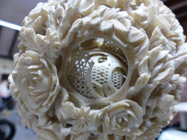 A CHINESE IVORY PUZZLE BALL CARVING WITH STAND HAVING A ROTATING RETICULATED KNOP AND A FURTHER - Image 18 of 20