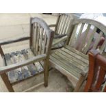 A TEAK GARDEN TABLE WITH UMBRELLA AND FOUR CHAIRS.