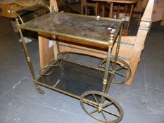 A RETRO BRASS FRAMED DRINKS TROLLEY.