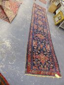 AN ANTIQUE PERSIAN TRIBAL RUNNER. 516 x 108cms.