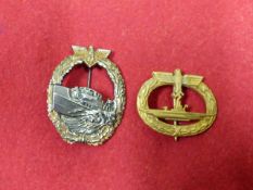 A THIRD REICH SUBMARINE WAR BADGE IN GILT TOGETHER WITH A DAMAGED 1ST PATTERN TORPEDO BOAT BADGE. (