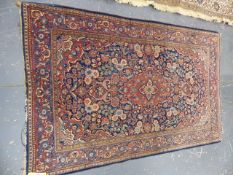 AN ANTIQUE PERSIAN KASHAN RUG. 210 x 130cms.