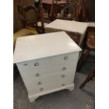 A PAIR OF PAINTED PINE BEDSIDE CHESTS OF TWO SHORT AND THREE LONG DRAWERS WITH RING HANDLES