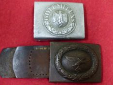 A THIRD REICH OTHER RANKS ALLOY BELT BUCKLE TOGETHER WITH A THIRD REICH STEEL LUFTWAFFE BELT BUCKLE.