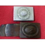 A THIRD REICH OTHER RANKS ALLOY BELT BUCKLE TOGETHER WITH A THIRD REICH STEEL LUFTWAFFE BELT BUCKLE.