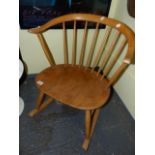 AN ERCOL PALE ELM COTTAGE SMALL ROCKING CHAIR WITH BS1960 STAMP.