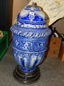 A GERMAN POTTERY VESSEL MOUNTED AS A LAMP. H.60cms.