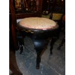 AN ART DECO EBONISED ROUND STOOL WITH GILT DECORATION, POSSIBLY AUSTRIAN.