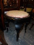 AN ART DECO EBONISED ROUND STOOL WITH GILT DECORATION, POSSIBLY AUSTRIAN.