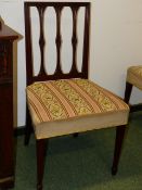 A SET OF SIX GEO.III. CARVED MAHOGANY DINING CHAIRS WITH NEEDLEWORK SEATS. (6)