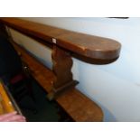 A PAIR OF LARGE WALNUT OR FRUITWOOD FORMS OR BENCHES. L.310cms.