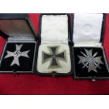 IRON CROSS 1st. CLASS, BOXED TOGETHER WITH A WAR MERIT CROSS 1st. CLASS WITH SWORDS, BOXED,