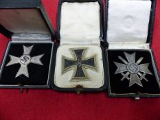 IRON CROSS 1st. CLASS, BOXED TOGETHER WITH A WAR MERIT CROSS 1st. CLASS WITH SWORDS, BOXED,