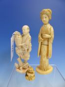 A JAPANESE MARINE IVORY FIGURE OF A FRUIT HARVESTER WITH A SQUIRREL ON HIS SLEEVE. H.13.5cms