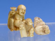 THREE JAPANESE MARINE IVORY OKIMONOS, ONE WITH A CHILD STANDING ON IT'S SEATED MOTHER'S SHOULDERS.