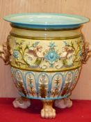 A EUROPEAN MAJOLICA PLANTER WITH LION HEAD MASK AND RING HANDLES BELOW THE TURQUOISE RIM, TWO PALE