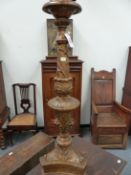 A GILT GESSO BAROQUE STYLE FLOOR STANDING CANDLESTICK LAMP, THE FOLIATE BALUSTER COLUMN ON
