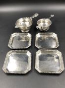 TWO SILVER HALLMARKED TEA STRAINERS COMPLETE WITH BOWLS AND FOUR SILVER HALLMARKED DRIP TRAYS. GROSS