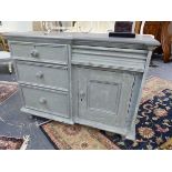 A 19th.C.PAINTED PINE SMALL DRESSER WITH FOUR DRAWERS AND PANEL DOOR CUPBOARD ON TURNED FEET. 116