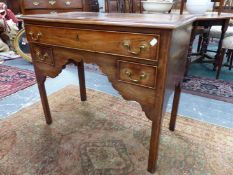 A MAHOGANY LOW BOY, THE CYMA EDGED TOP OVER A LONG DRAWER AND TWO SHORT DRAWERS ON SQUARE