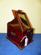 A CHINESE RED LACQUER WEDDING OR VANITY CHEST, THE LID RISING ABOVE THREE DRAWERS TO SUPPORT A