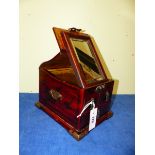 A CHINESE RED LACQUER WEDDING OR VANITY CHEST, THE LID RISING ABOVE THREE DRAWERS TO SUPPORT A