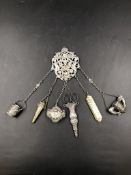 A VICTORIAN SILVER HALLMARKED CHATELAINE, DATED 1890, WITH SIX VARIOUS APPENDAGES, SOME SILVER AND