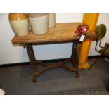 A HOLLAND LEICESTER A PINE TOPPED WORKBENCH REMOVABLE FROM ITS IRON BASE ON CASTER FEET. W 96 x D 58