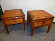 A PAIR OF CHINESE HARDWOOD BEDSIDE TABLES WITH APRON DRAWERS, THE TAPERING SQUARE SECTIONED LEGS