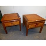 A PAIR OF CHINESE HARDWOOD BEDSIDE TABLES WITH APRON DRAWERS, THE TAPERING SQUARE SECTIONED LEGS