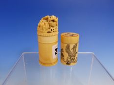 TWO CHINESE IVORY CYLINDRICAL BOXES, THE TALLER TOPPED BY A LIONESS AND CUB. H 7.5cms THE SMALLER