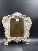 A CONTINENTAL SILVER MOUNTED RECTANGULAR MIRROR, THE OVAL AT THE TOP OF THE ROCOCO FRAME DATED 15