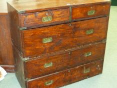 A 19th.C. MAHOGANY AND BRASS MOUNTED TWO PART CAMPAIGN CHEST OF DRAWERS.