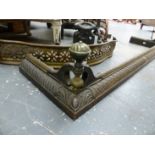 A VICTORIAN CAST IRON AND BRASS MOUNTED FIRE CURB. W.137cms TOGETHER WITH A SMALL PIERCED BRASS