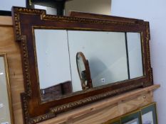 AN 18th.C.STYLE WALNUT VENEERED THREE PLATE MIRROR, THE RECTANGULAR FRAME ACCENTUATED AT THE CORNERS