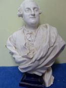 A VOLKSTEDT BISCUIT PORCELAIN BUST OF LOUIS XVI ON GILT BLUE SOCLE. H 28cms.