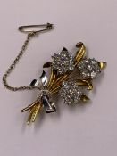 AN 18ct GOLD AND PLATINUM DIAMOND SPRAY BROOCH. THE TRIPLE DIAMOND CLUSTERS ARE BRILLIANT CUT AND