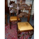 A SET OF FOUR 17th.C.STYLE OAK DINING CHAIRS WITH CARVED BACKS, TURNED LEGS AND STRETCHERS. (4)