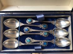 A SET OF SIX TEA SPOONS STAMPED STG SILVER, EACH BEZEL SET WITH A OVAL OPAL WITH FLASHES OF BLUE/