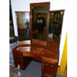 A GERMAN ART DECO STYLE WALNUT AND INLAID DRESSING TABLE WITH RAISED MIRROR DOOR CABINET OVER AND